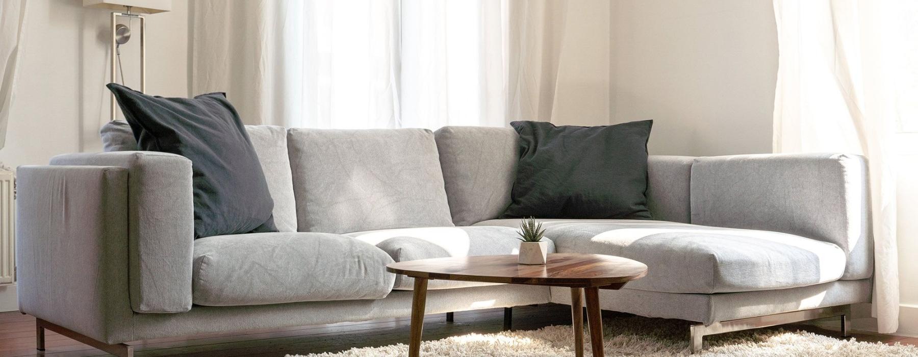 oversized windows brighten spacious, furnished living room