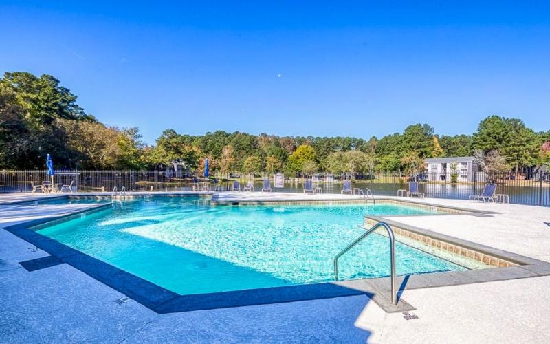 a swimming pool with a fence around it